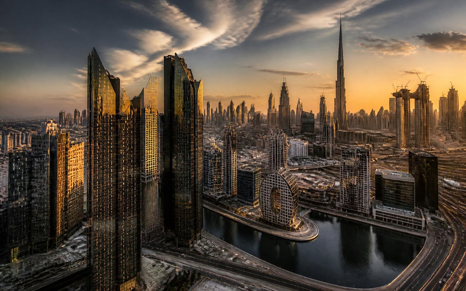 Dubai Business Bay skyline at golden hour with Burj Khalifa